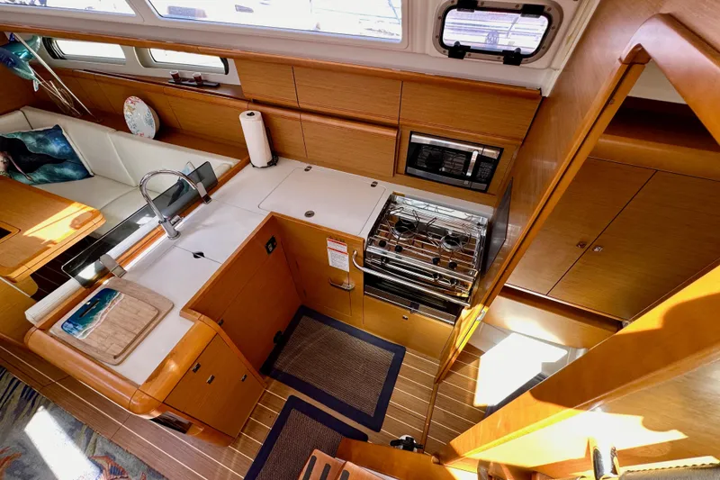 Slide: The Image of Interior of 2015 Jeanneau Sun Odyssey 409 yacht kitchen with modern amenities. - 42