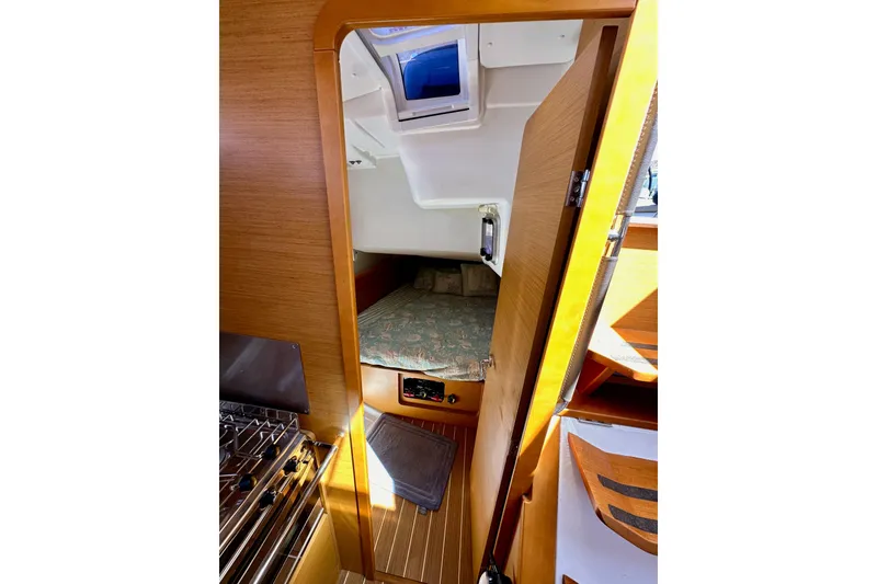 Slide: The Image of Interior cabin view of 2015 Jeanneau Sun Odyssey 409 sailboat, featuring cozy sleeping area. - 47