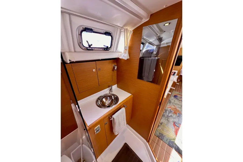Slide: The Image of Interior of 2015 Jeanneau Sun Odyssey 409 yacht bathroom with sink and mirror. - 56