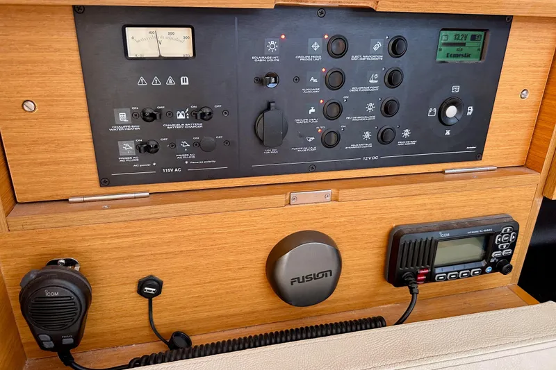 Slide: The Image of Control panel of a 2015 Jeanneau Sun Odyssey 409 sailboat with communication equipment. - 60
