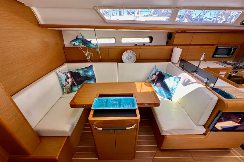 Slide: The Image of Interior of 2015 Jeanneau Sun Odyssey 409 yacht with cozy seating and nautical decor. - 62