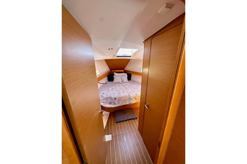 Slide: The Image of Cozy cabin interior of 2015 Jeanneau Sun Odyssey 409 sailboat with wooden finish. - 65