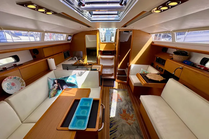 Slide: The Image of Luxurious interior of 2015 Jeanneau Sun Odyssey 409 sailboat with elegant seating and decor. - 71