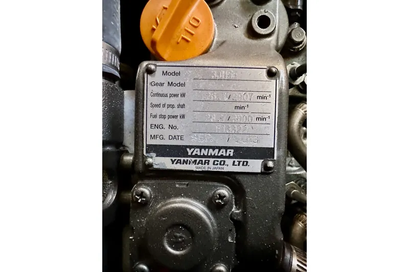 Slide: The Image of Yanmar engine plate on Jeanneau Sun Odyssey 409, 2015 model, showing specifications and manufacturing details. - 73