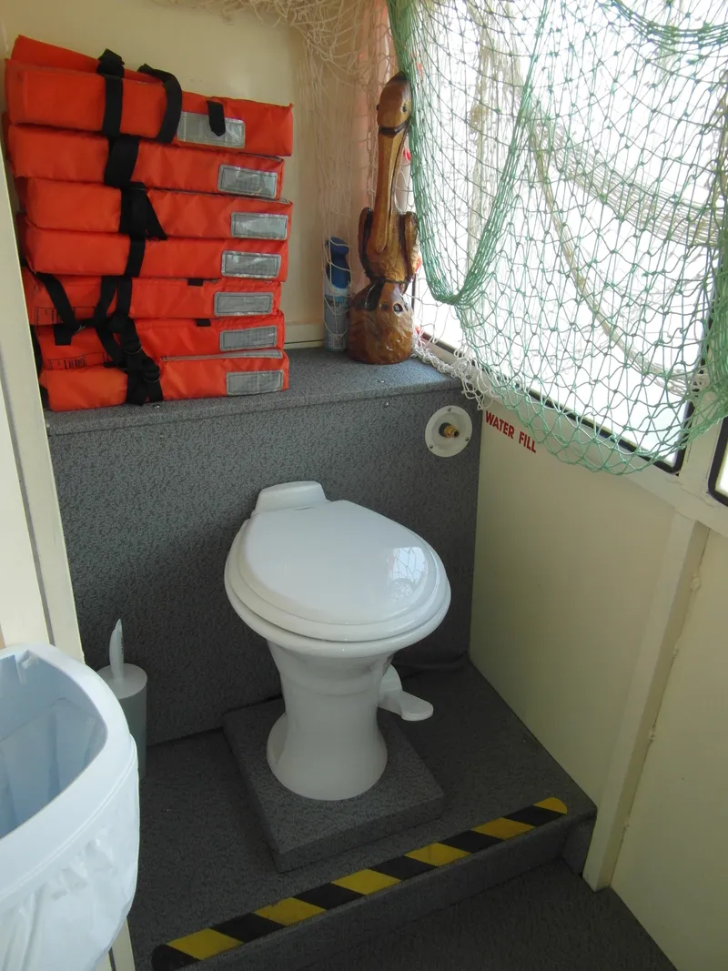 Slide: The Image of Boat restroom with life jackets, Trident 40 Passenger Tour Boat, 2005 model. - 11