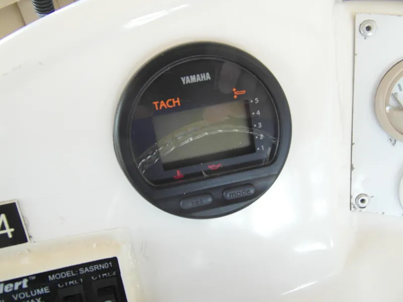 Slide: The Image of Yamaha tachometer on 2005 Trident 40 Passenger Tour Boat dashboard. - 21
