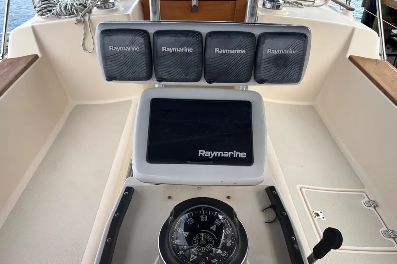 Slide: The Image of Cockpit of 1995 Island Packet 37 sailboat with Raymarine navigation equipment. - 12