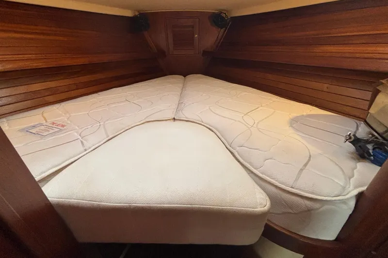 Slide: The Image of Cozy cabin interior of 1995 Island Packet 37 sailboat with comfortable bedding. - 19