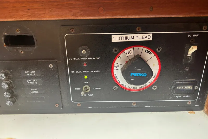 Slide: The Image of Control panel of a 1995 Island Packet 37 sailboat with Perko switch and bilge pump controls. - 27