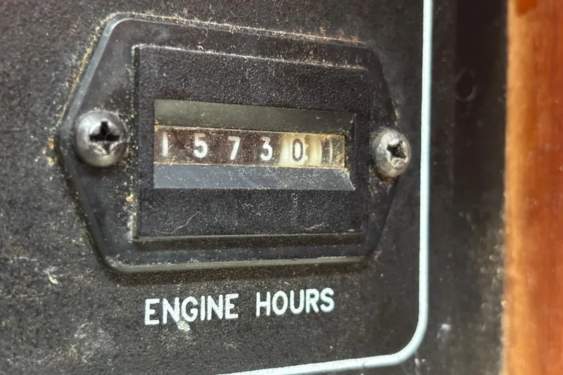 Slide: The Image of Engine hour meter showing 1573.01 hours on 1995 Island Packet 37. - 3
