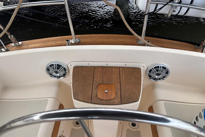 Slide: The Image of Cockpit of 1995 Island Packet 37 sailboat with wooden accents and speakers. - 7