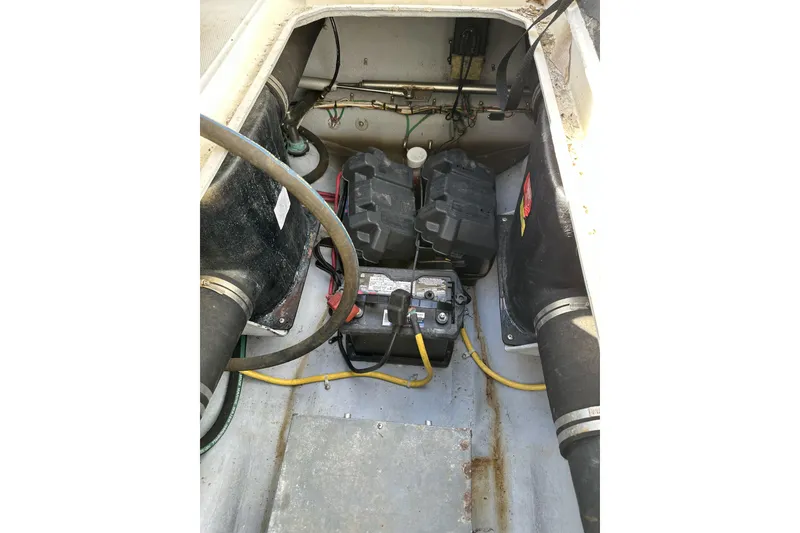 Slide: The Image of 2005 Albemarle 280 Express Fisherman engine compartment with visible wiring and components. - 15