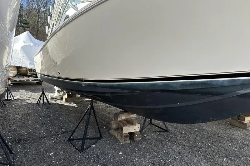 Slide: The Image of 2005 Albemarle 280 Express Fisherman boat on stands, side view, outdoors. - 17