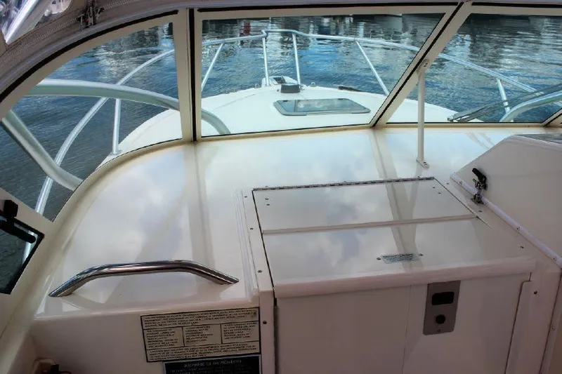 Slide: The Image of 2005 Albemarle 280 Express Fisherman boat interior with helm and water view. - 4