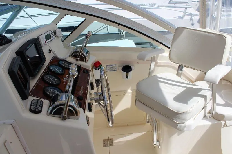 Slide: The Image of 2005 Albemarle 280 Express Fisherman helm with controls and seating. - 5