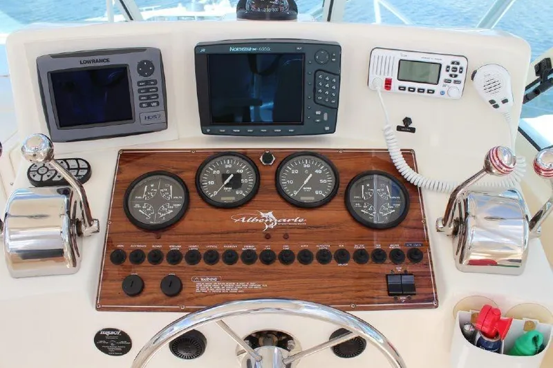 Slide: The Image of 2005 Albemarle 280 Express Fisherman dashboard with navigation and control instruments. - 6