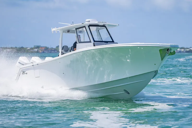 Slide: The Image of 2025 Streamline R 35 boat cruising swiftly on open water. - 10