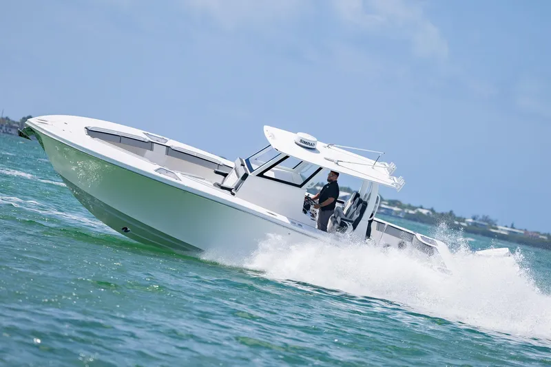 Slide: The Image of 2025 Streamline R 35 boat cruising on open water, creating waves. - 11