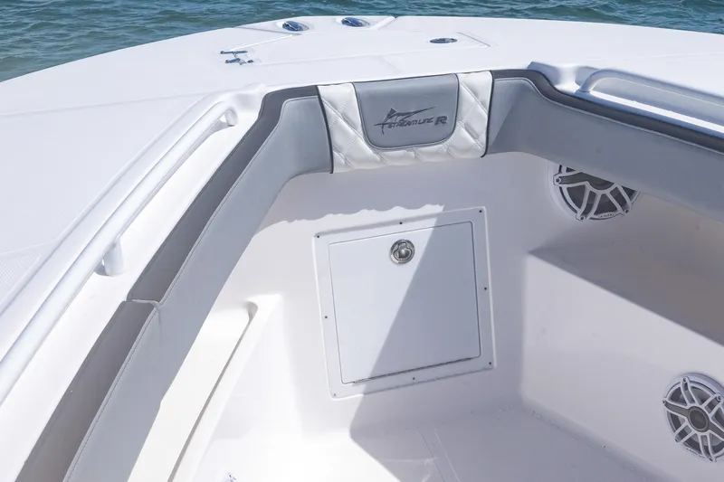 Slide: The Image of Interior of 2025 Streamline R 35 boat with sleek seating and storage. - 13