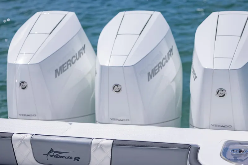 Slide: The Image of Triple Mercury Verado engines on a 2025 Streamline R 35 boat. - 36