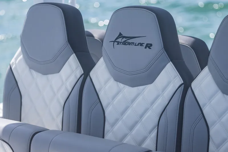 Slide: The Image of Luxurious 2025 Streamline R 35 boat seats with quilted design on a sunny day. - 37