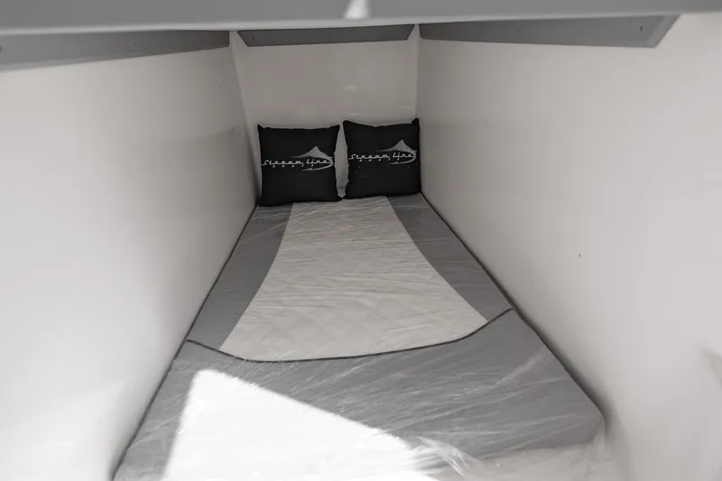 Slide: The Image of Compact sleeping area in 2025 Streamline R 35 with pillows and bedding. - 38