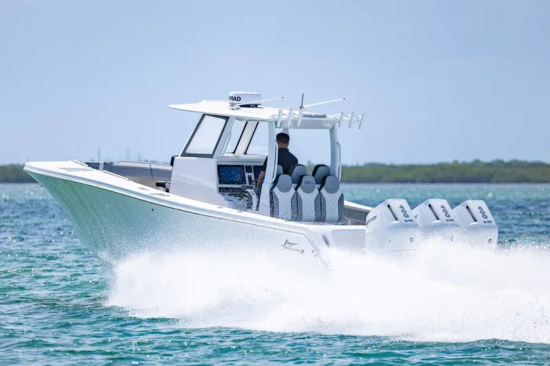 Slide: The Image of Streamline R 35 boat cruising on water, 2025 model, with four powerful outboard engines. - 9