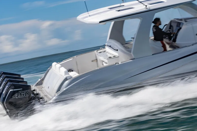 Slide: The Image of 2024 Deep Impact 399 Sport boat speeding on water with powerful engines. - 17