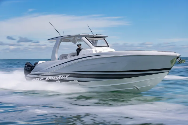 Slide: The Image of 2024 Deep Impact 399 Sport boat cruising on open water, showcasing sleek design and performance. - 18
