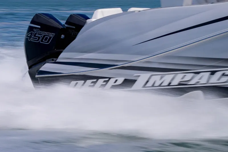 Slide: The Image of 2024 Deep Impact 399 Sport boat speeding on water, showcasing powerful engines. - 19