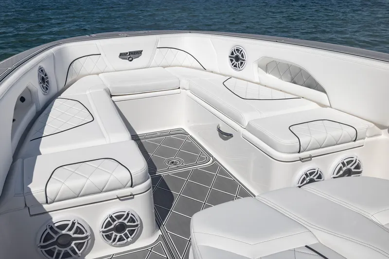 Slide: The Image of Luxurious seating area on 2024 Deep Impact 399 Sport boat, featuring elegant white upholstery. - 22