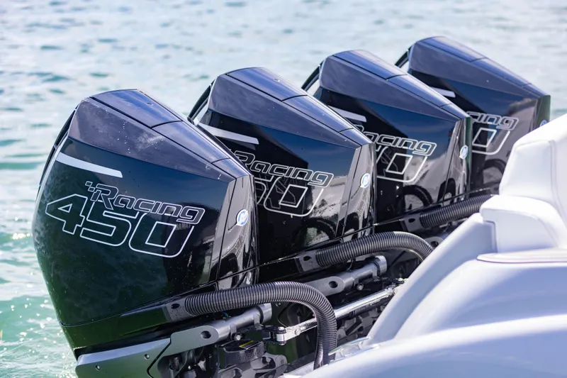 Slide: The Image of Four powerful outboard motors on a 2024 Deep Impact 399 Sport boat. - 3