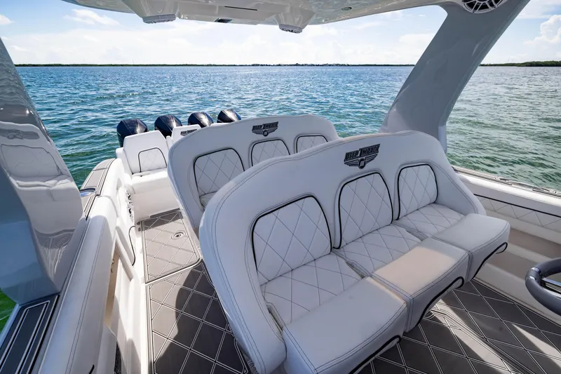 Slide: The Image of 2024 Deep Impact 399 Sport boat interior with luxurious seating on open water. - 53