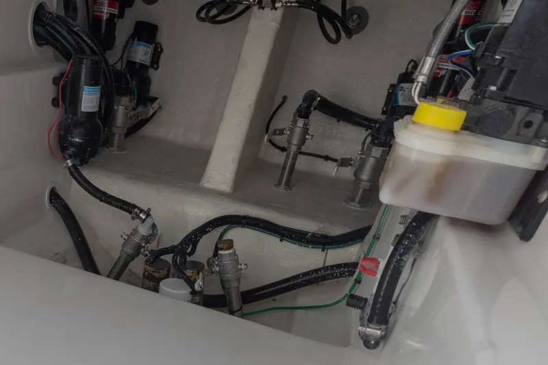 Slide: The Image of Engine compartment of 2024 Deep Impact 399 Sport boat, showcasing intricate wiring and components. - 58