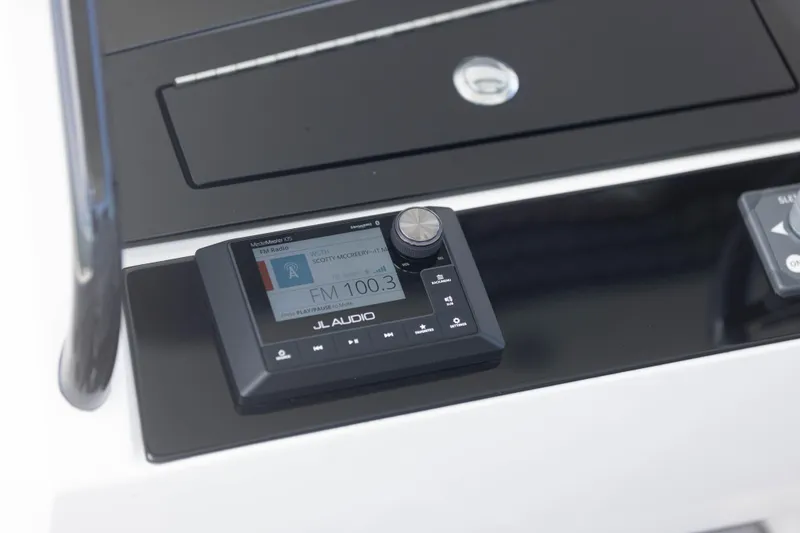 Slide: The Image of JL Audio system on 2024 Deep Impact 399 Sport boat dashboard. - 64