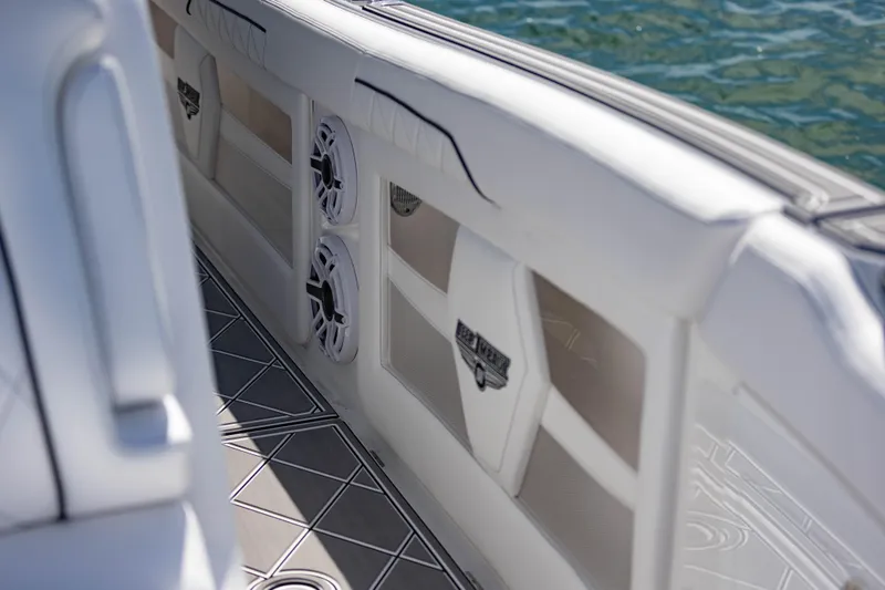 Slide: The Image of 2024 Deep Impact 399 Sport boat interior with speakers and sleek design. - 69