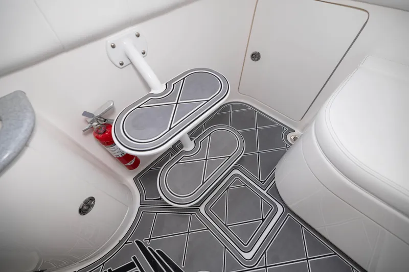 Slide: The Image of Interior of 2024 Deep Impact 399 Sport boat with stylish flooring and fire extinguisher. - 75