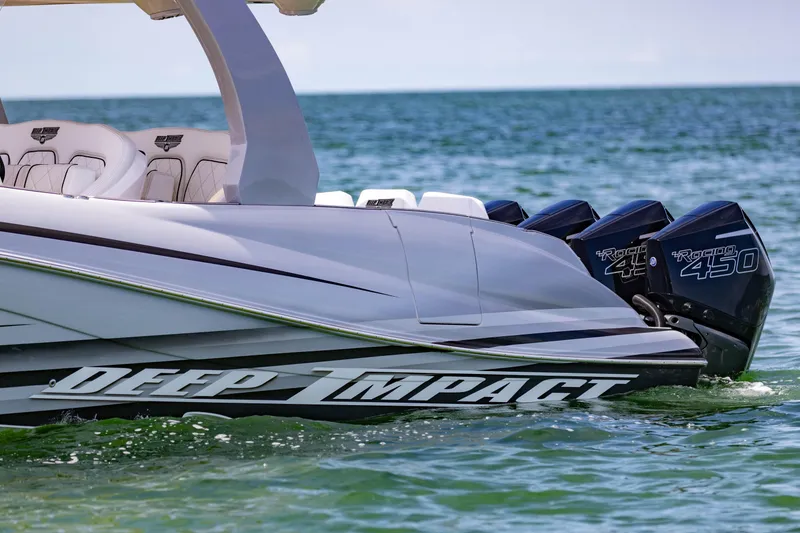 Slide: The Image of 2024 Deep Impact 399 Sport boat with powerful Racing 450 engines on the water. - 9
