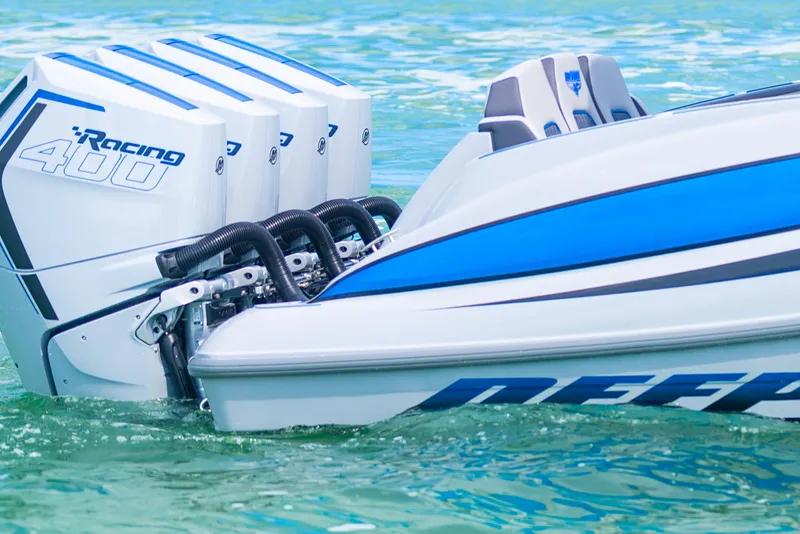 Slide: The Image of 2023 Deep Impact 399 Sport boat with powerful Racing 400 engines on clear water. - 15