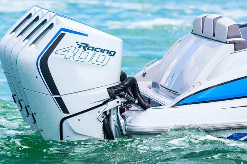 Slide: The Image of 2023 Deep Impact 399 Sport boat with Racing 400 engines on water. - 16