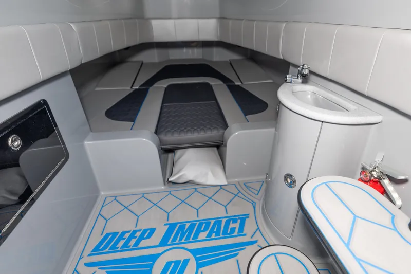 Slide: The Image of Interior of 2023 Deep Impact 399 Sport boat with modern seating and compact sink. - 26