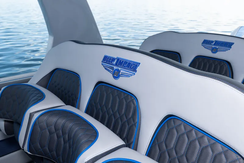 Slide: The Image of Luxury seating in 2023 Deep Impact 399 Sport boat, featuring blue and black accents. - 29