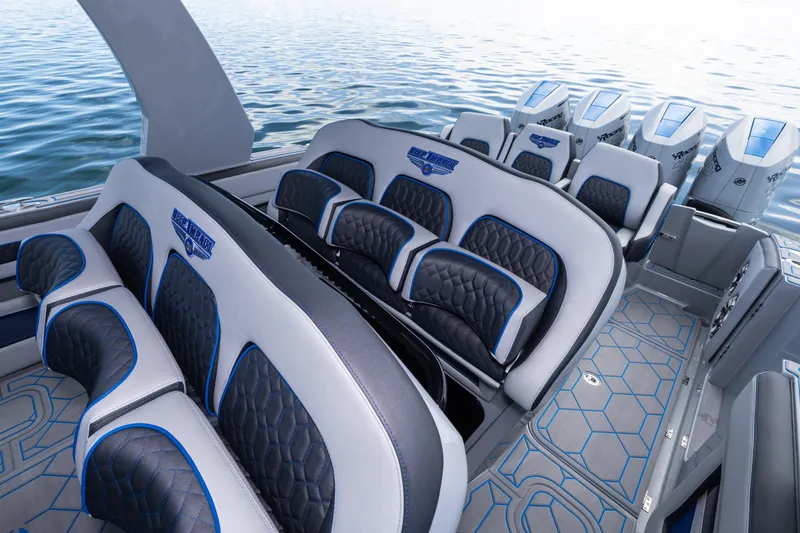 Slide: The Image of Luxury seating on 2023 Deep Impact 399 Sport boat with powerful engines, on calm water. - 30