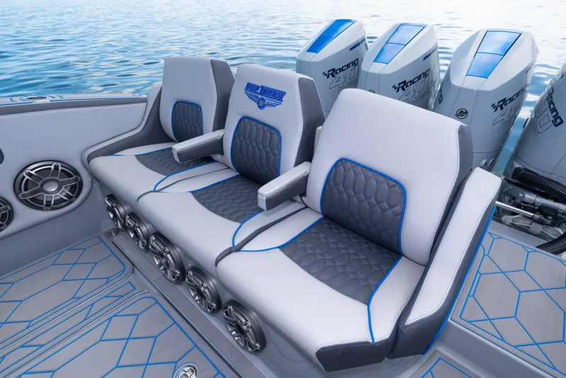 Slide: The Image of Luxury seating on 2023 Deep Impact 399 Sport boat with powerful outboard engines. - 34