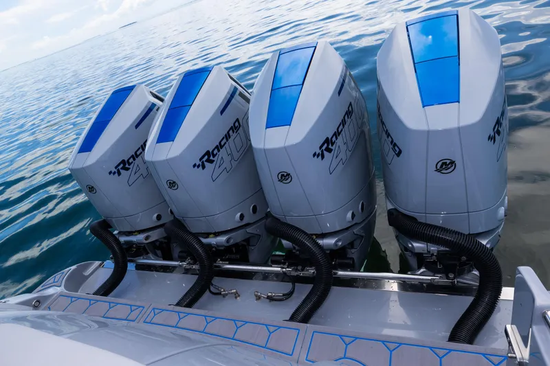 Slide: The Image of Four powerful outboard engines on a 2023 Deep Impact 399 Sport boat. - 35