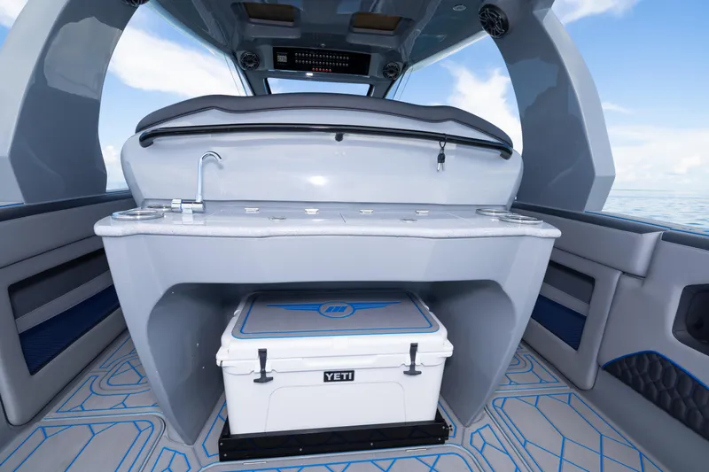 Slide: The Image of 2023 Deep Impact 399 Sport boat interior with sink and Yeti cooler. - 36