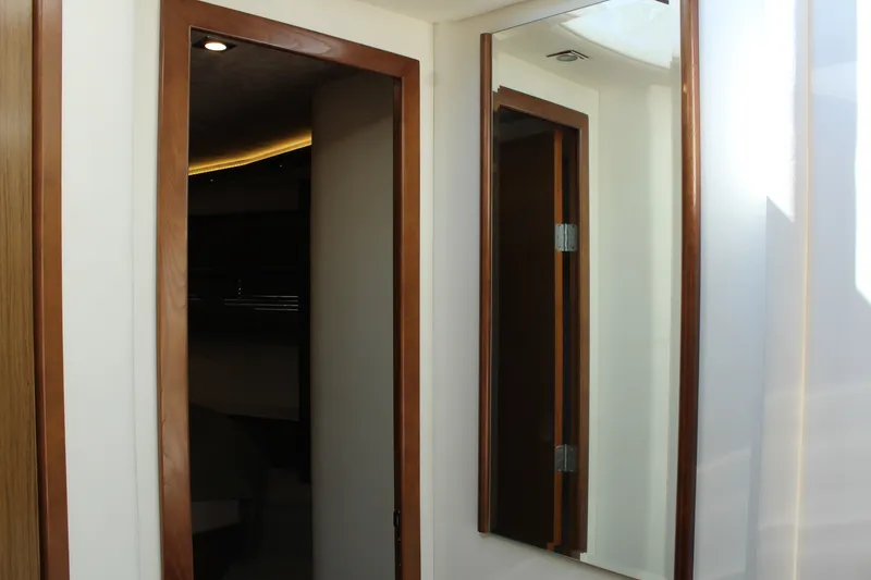 Slide: The Image of Interior of 2014 Cruisers Yachts 45 Cantius with wood frame and mirror. - 34