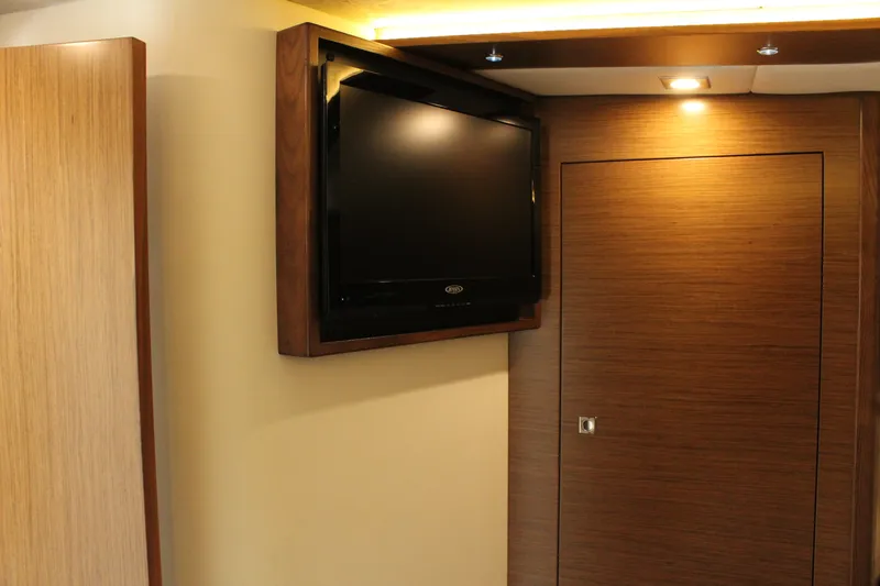 Slide: The Image of Interior of 2014 Cruisers Yachts 45 Cantius with TV and wooden doors. - 38