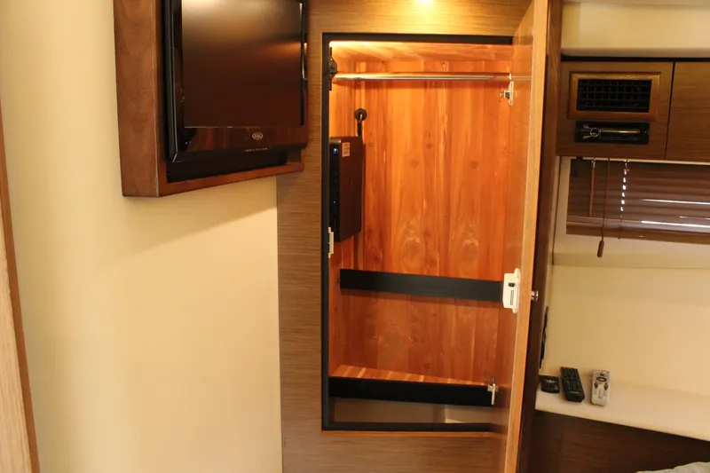 Slide: The Image of Interior of 2014 Cruisers Yachts 45 Cantius with closet and TV. - 39