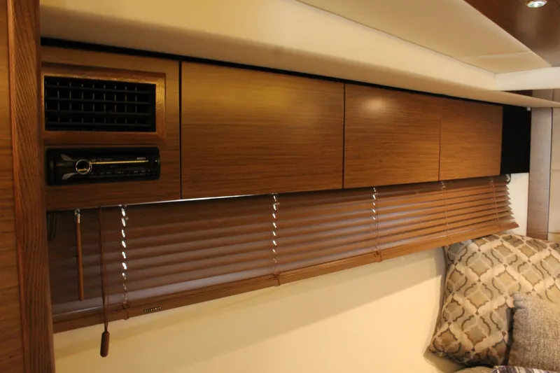 Slide: The Image of Interior of 2014 Cruisers Yachts 45 Cantius with wooden cabinets and blinds. - 40